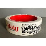 A ceramic Haigs Scotch whisky ash tray