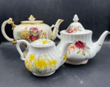 A selection of three teapots to include Royal Albert and Holly Barn