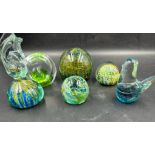 A selection of six glass paper weights to include Mdina