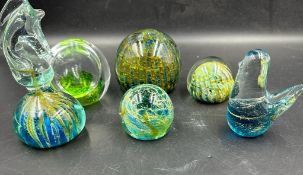 A selection of six glass paper weights to include Mdina