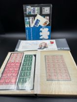 A stamp album containing a small selection of Great British mint stamps along with some from Monaco,