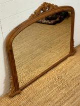 A pine over mantle mirror with carved scrolling details (120cm x 90cm)