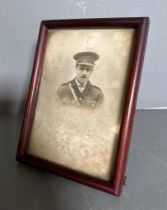 A portrait of a WWI medical Corp officer in an easel back frame
