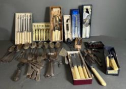 A selection of silver plate and white metal cutlery