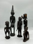 Five primitive carved tribe figures