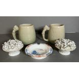 A selection of ceramics to include two Thai crackle glazed mugs, a pair of floral displays and a