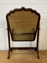 A Edwardian mahogany framed toilet mirror on splayed feet