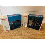 Two boxed Bosch power tools, a jigsaw and a impact drill