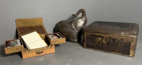 A selection of curios to include a white metal elephant, a vintage tine and a cased bridge set