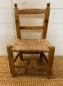 A pine rush seated child chair