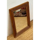 A wall hanging hall mirror in a pine fluted frame (62cm x 78cm)