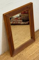 A wall hanging hall mirror in a pine fluted frame (62cm x 78cm)
