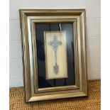 A framed white metal Ethiopian Coptic cross