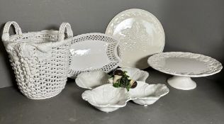 A selection of white ceramics to include a basket, cake stand and platters various makers