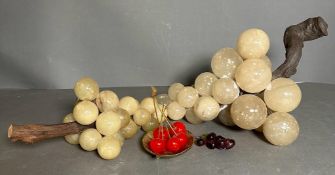 A selection of glass grapes and cherries