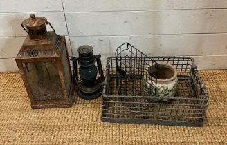 A selection of items to include two lanterns a ceramic pot and two wire items