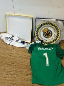 A signed Goal keepers shirt for Lukas Hradeck Finland National team, along with a plate from El