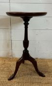 A mahogany tripod wine table on turned central column (H50cm Dia30cm)