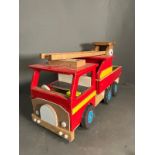 A large wooden fire truck toy