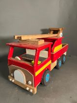 A large wooden fire truck toy