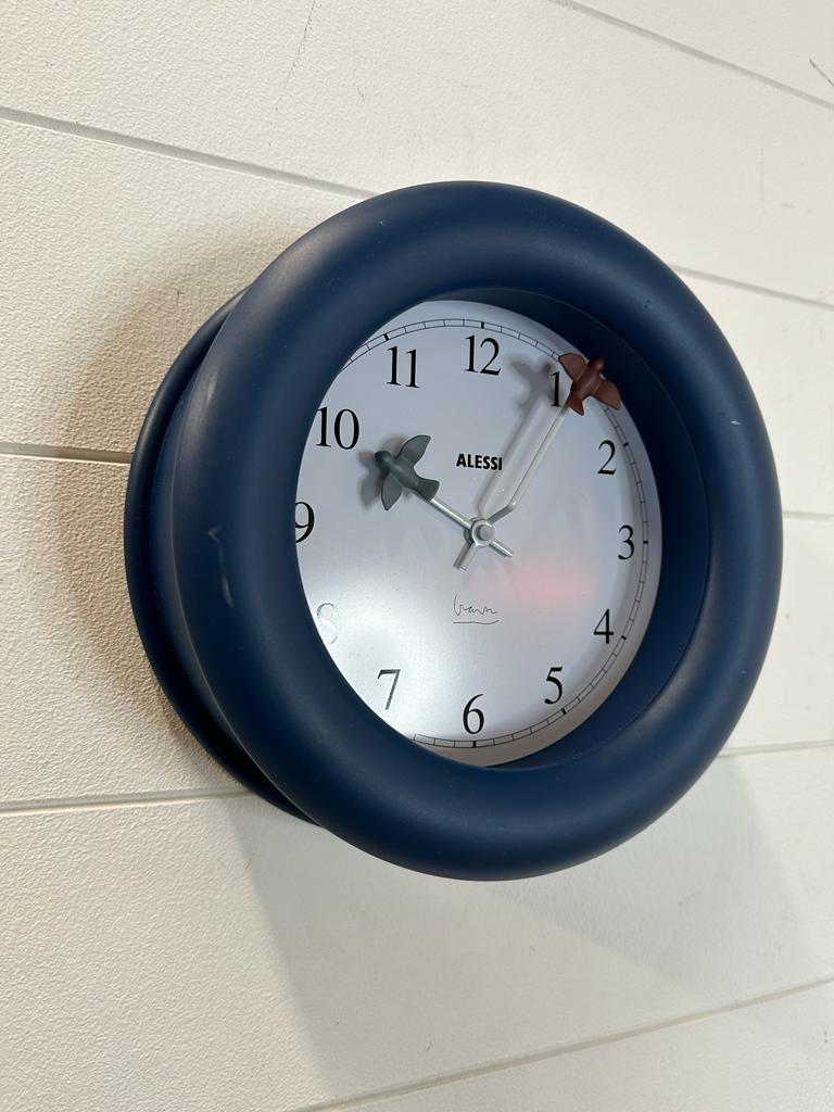 An Alessi "Fino Flies" kitchen wall clock in blue