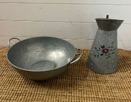 A metal jug and a wash bowl