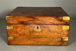 A mahogany brass bound campaign style writing slope