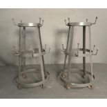A pair of grey metal cup holders (H35cm)