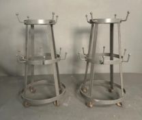 A pair of grey metal cup holders (H35cm)