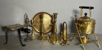 A selection of brass and metal items to include a spirit kettle, candle sticks and a iron warmer