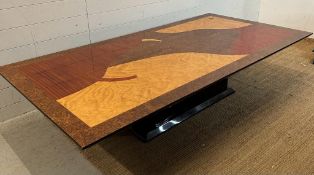 A large and deco style mixed wood veneered coffee table (H93cm W200cm D10cm)