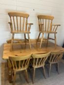 A pine farmhouse table with eight chairs (H77cm W168cm D83cm)