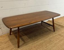 A Mid Century Ercol coffee table with shelf under (H36cm W104cm D46cm)