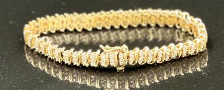 A 14ct gold and diamond bracelet, approximate total weight 17.6g