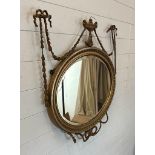 A gilt framed wall hanging mirror in the Rococo style 70cm x 80cm