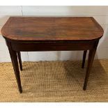 A mahogany folding card table with string inlay and tapering legs (H76cm W94cm D46cm)