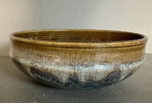 A Studio pottery bowl glazed in browns, blues and greys