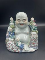 A ceramic Chinese Buddha of Happiness figure, approximately 16.5cm H