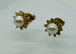 A pair of pearl and diamond 18ct gold earrings