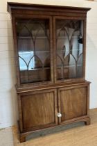 A Georgian style display cabinet, two glazed doors of astragal design and two door cupboard under (