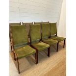 Eight Danish mid-century dining chairs by Johannes Anderson upholstered in green