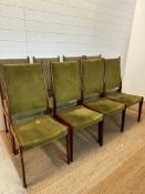 Eight Danish mid-century dining chairs by Johannes Anderson upholstered in green