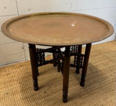 A foldable brass topped Indian tea table