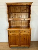 A pine two drawer two cupboard dresser with a two drawer plate rack over (H185cm W97cm D44cm)