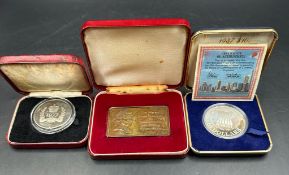 Three collectable coins and medals:
