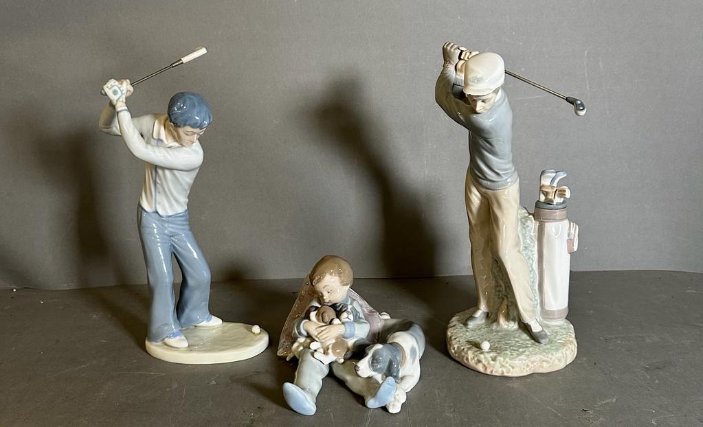 Two golfing Lladro figures and a young boy with puppet