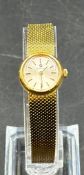 An 18ct gold Ladies Omega watch in original box.