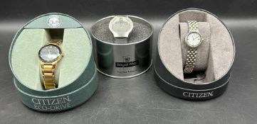 Three watches, boxed two Citizen and the other a Royal Mail The Lord of The Rings The Two Towers