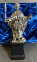 A silver figure of Henry VI, founder of Eton college and a representation of the statue in Eton