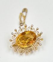 A citrine and 9ct gold brooch with saftey chain, approximate total weight 6g.